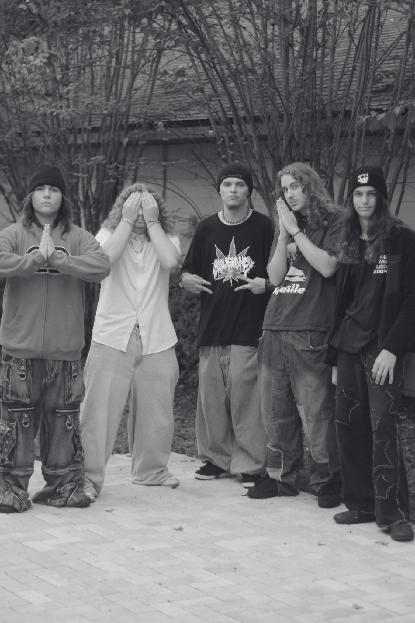 Exoplasm — five-piece nu metal band posing on a stairwell at night